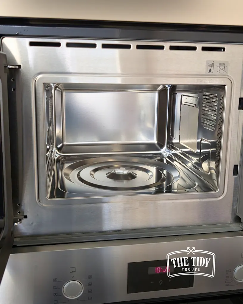Inside of a microwave cleaned during a deep clean
